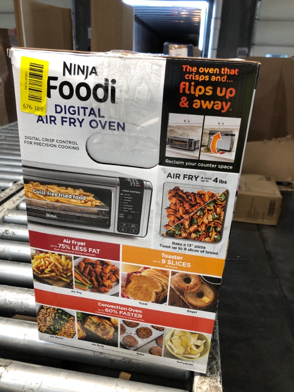 Photo 1 of ***Dented Top*** Ninja Digital Air Fryer & Toaster Oven | 8-in-1 Functionality | Flip-Up Design | XL Capacity | Air Fry Basket, Sheet Pan, Wire Rack & Crumb Tray | 1800 Watt | Silver | SP101