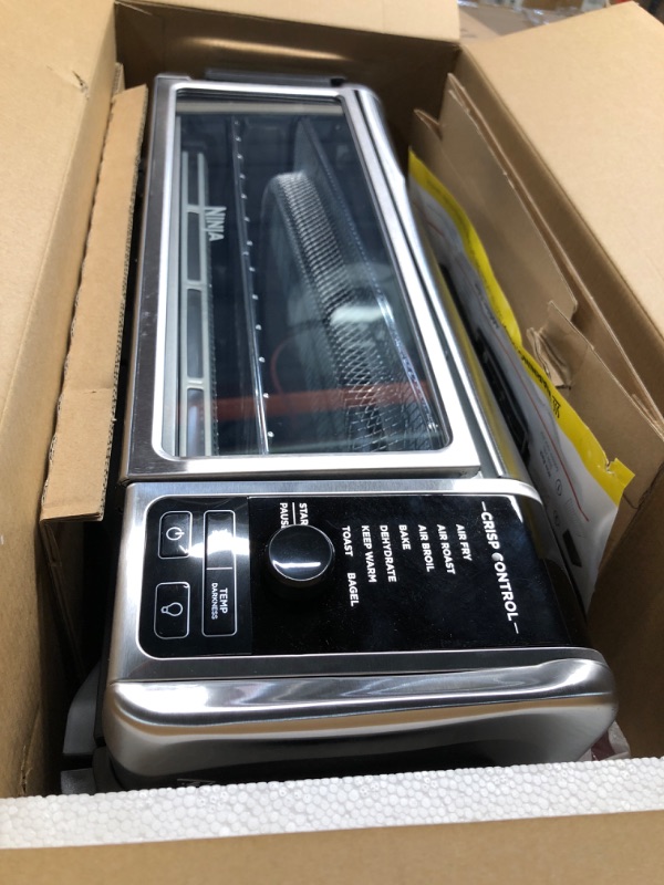 Photo 1 of ***Dented Top*** Ninja Digital Air Fryer & Toaster Oven | 8-in-1 Functionality | Flip-Up Design | XL Capacity | Air Fry Basket, Sheet Pan, Wire Rack & Crumb Tray | 1800 Watt | Silver | SP101