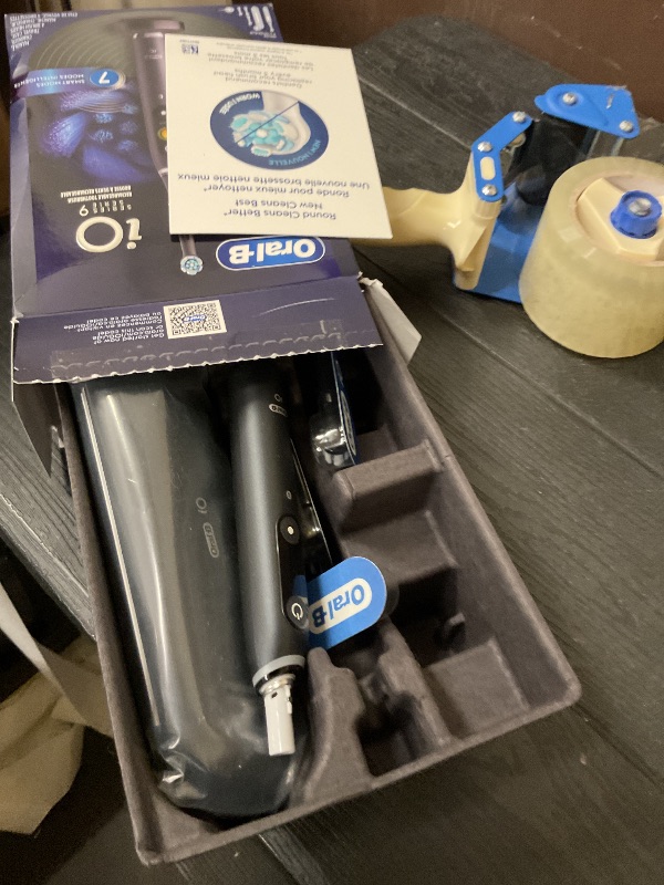 Photo 1 of Oral-B Rechargeable Electric Toothbrush, iO Series 9 Genius, Black, 4 Replacement Brush Heads, Power Charging Travel Case, Teeth Whitening, Visible Pressure Sensor to Protect Gums, 7 Modes