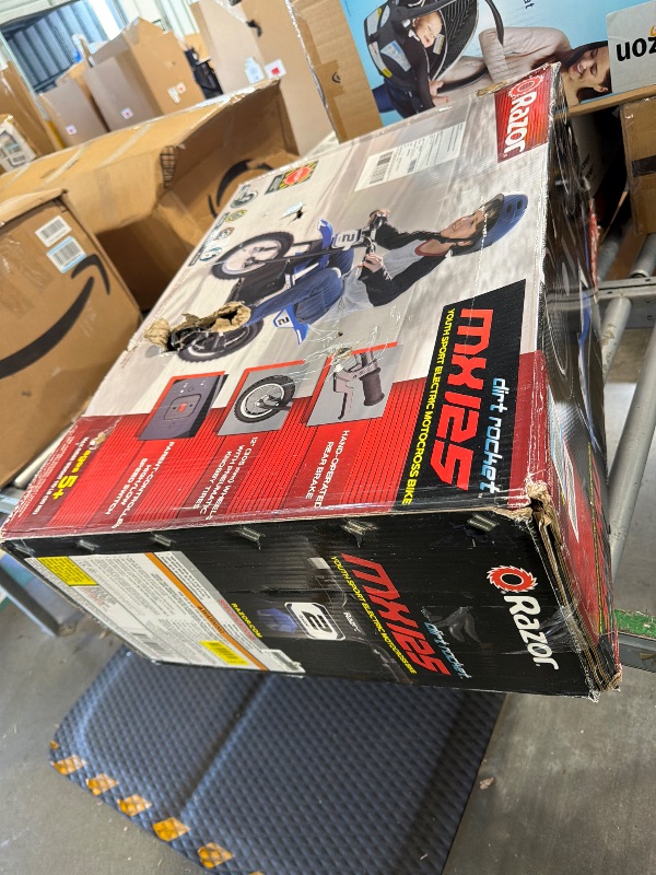 Photo 1 of ***VERY USED*** Razor MX125 Dirt Rocket Electric-Powered Bike with Authentic Motocross Geometry, Rear-Wheel Drive,100-watt, high-Torque, Chain-Driven Motor, for Kids 7+, Blue