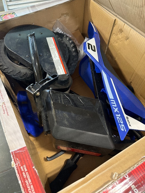 Photo 1 of ***VERY USED*** Razor MX125 Dirt Rocket Electric-Powered Bike with Authentic Motocross Geometry, Rear-Wheel Drive,100-watt, high-Torque, Chain-Driven Motor, for Kids 7+, Blue
