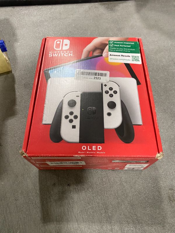 Photo 1 of Nintendo Switch OLED Model w/ White Joy-Con