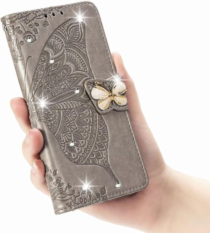 Photo 1 of Crystal Grey Flip Wallet Case for iPhone16 6.1in 3D Bling Butterfly Embossed Folio PU Leather with Magnetic Closure Credit Card Slots Holder/Lanyad Phone Cover for Women
