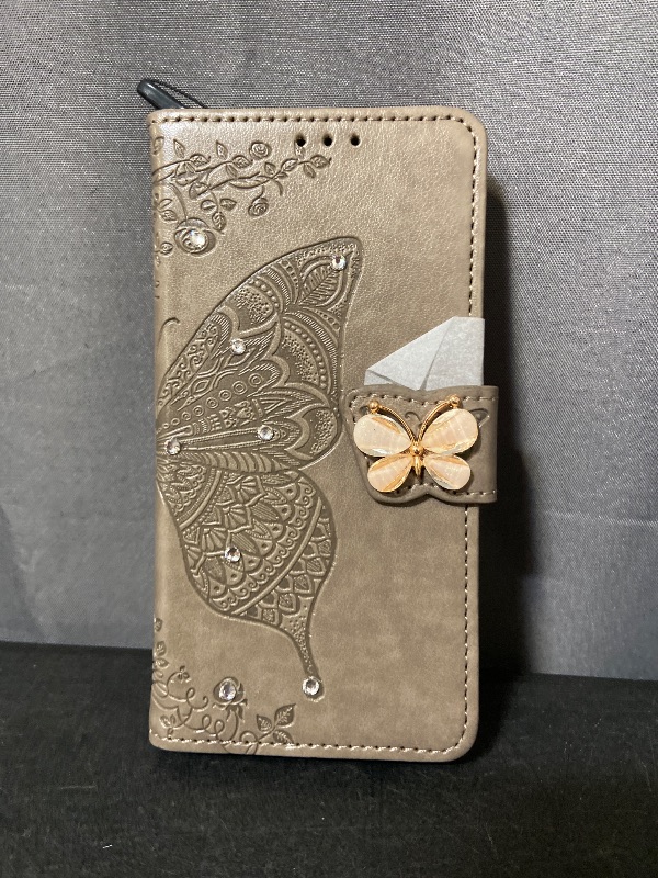 Photo 1 of Crystal Grey Flip Wallet Case for iPhone16 6.1in 3D Bling Butterfly Embossed Folio PU Leather with Magnetic Closure Credit Card Slots Holder/Lanyad Phone Cover for Women