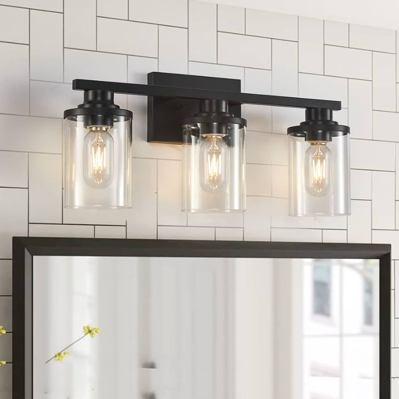 Photo 1 of 3-light matte black bathroom vanity light fixture complete with clear cylindrical glass shades and mounting hardware