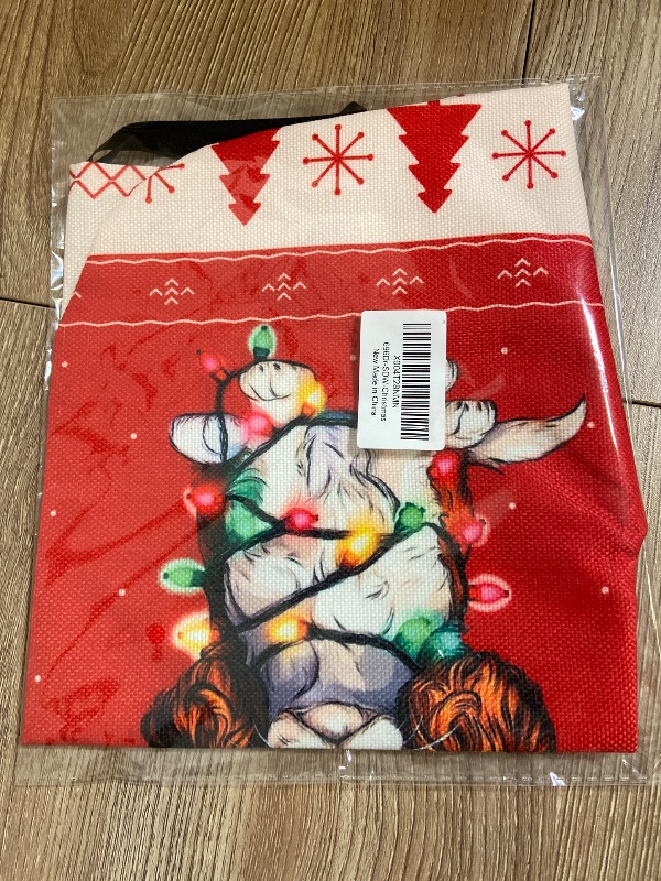 Photo 1 of Cavalier King Charles Spaniel Christmas stocking features a festive design of the breed wrapped in colorful holiday lights and wearing a Santa hat