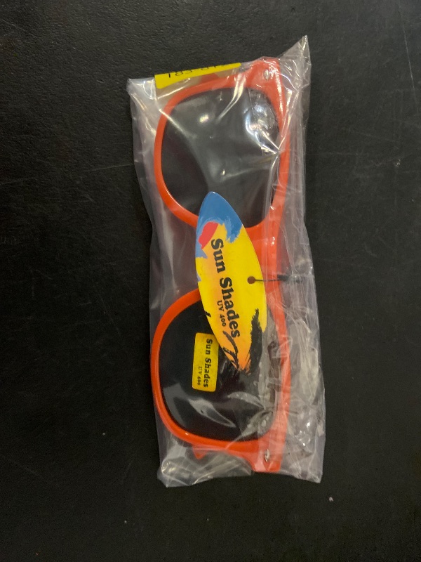 View 5 of bright orange, Wayfarer-style sunglasses feature dark lenses