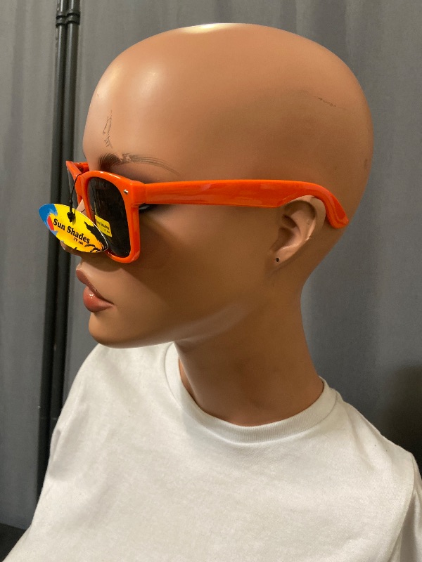 View 4 of bright orange, Wayfarer-style sunglasses feature dark lenses