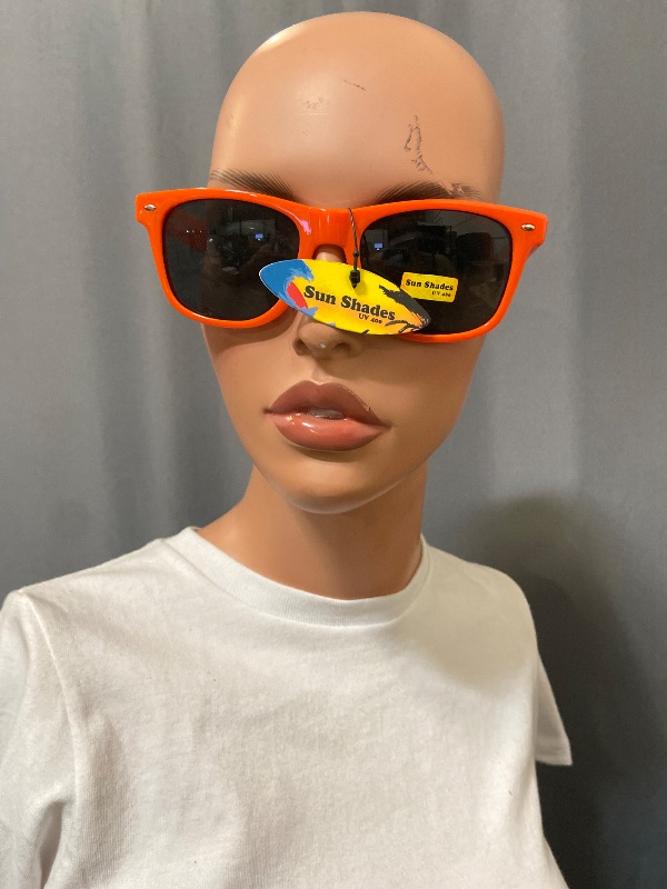 View 2 of bright orange, Wayfarer-style sunglasses feature dark lenses
