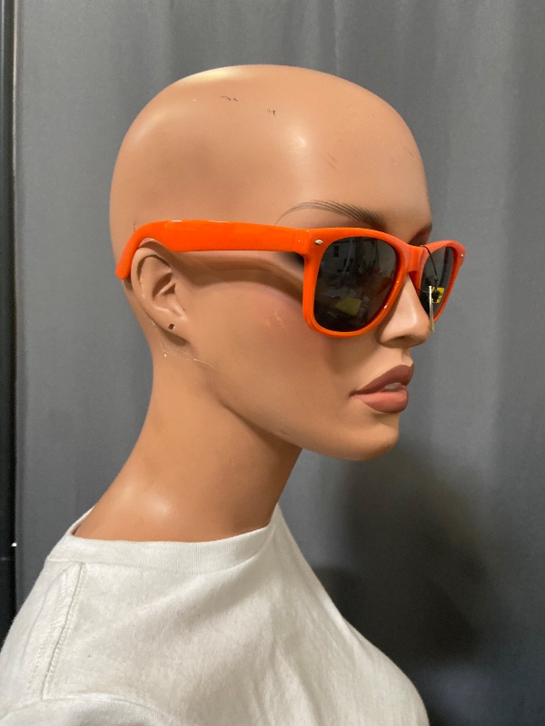 View 3 of bright orange, Wayfarer-style sunglasses feature dark lenses