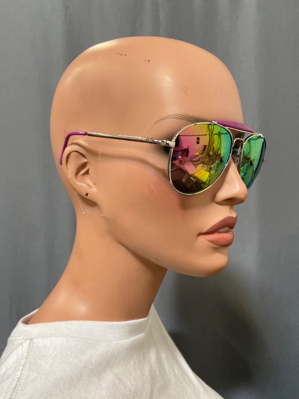 Photo 1 of Aviator sunglasses feature a distinctive silver metal frame paired with vibrant purple mirror lenses