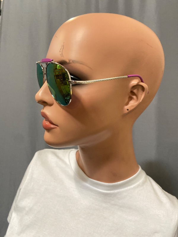 Photo 1 of Aviator sunglasses feature a distinctive silver metal frame paired with vibrant purple mirror lenses
