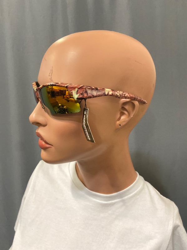 Photo 1 of sunglasses feature a camouflage frame and orange reflective lenses