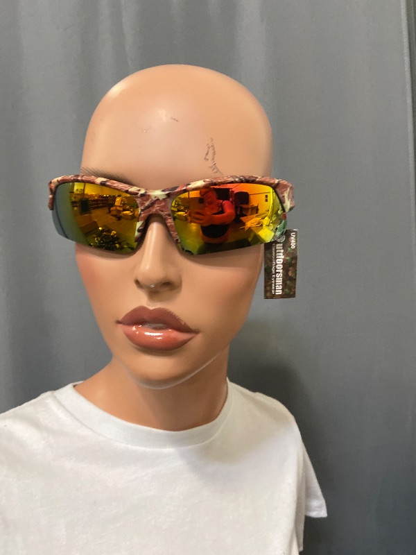 Photo 1 of sunglasses feature a camouflage frame and orange reflective lenses