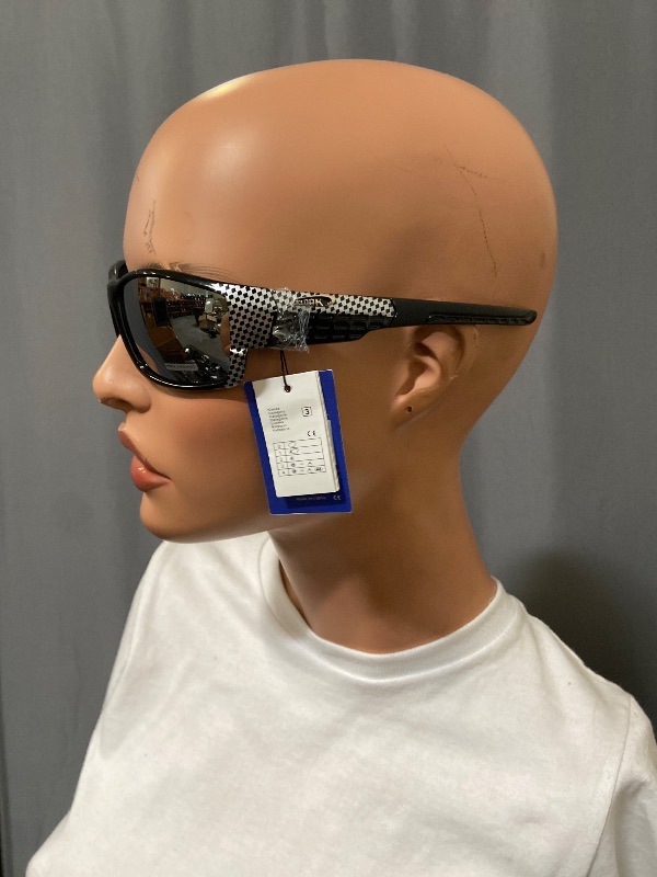 Photo 1 of sunglasses feature a distinct carbon fiber pattern on the frames and mirrored lenses