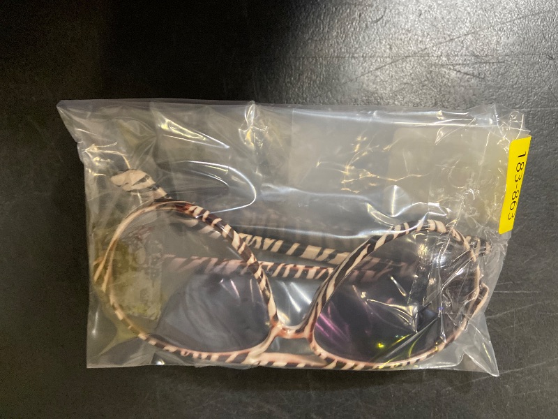 Photo 1 of Aviator sunglasses featuring a distinctive zebra-striped frame and gradient lenses