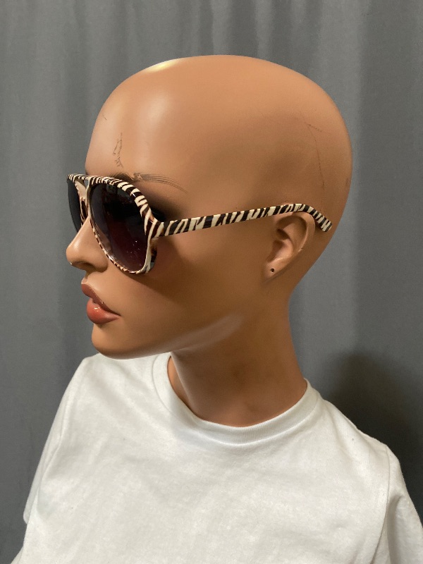 Photo 1 of Aviator sunglasses featuring a distinctive zebra-striped frame and gradient lenses