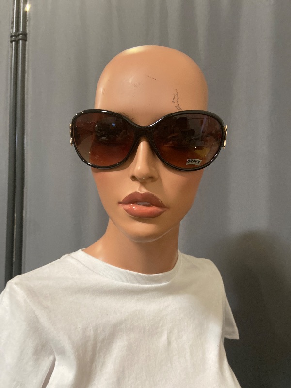 View 1 of  sunglasses feature distinct butterfly-shaped metal decorations on the temples