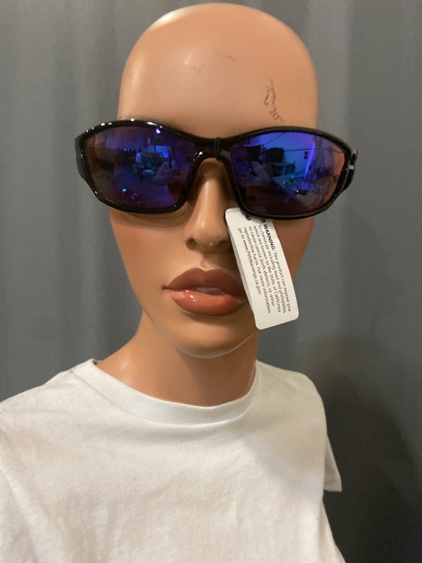 Photo 1 of black wrap-around sunglasses resemble the Oakley Straight Jacket model with purple lenses.