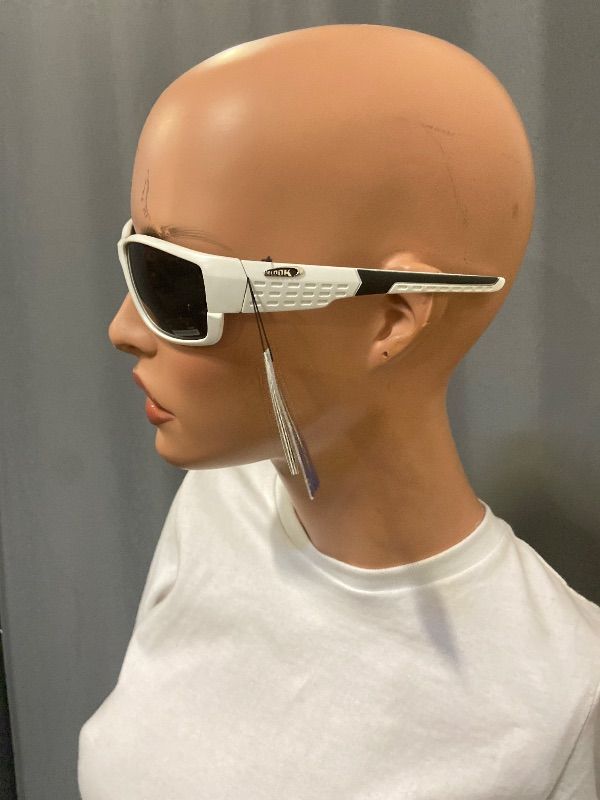 Photo 1 of white sport sunglasses feature ventilated side shields for increased peripheral vision