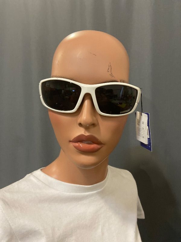 Photo 1 of white sport sunglasses feature ventilated side shields for increased peripheral vision