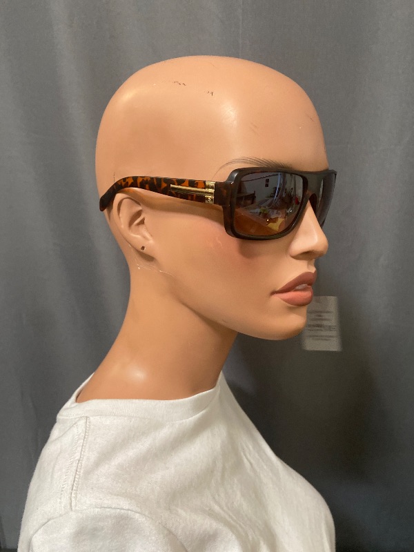 Photo 1 of  sunglasses feature a stylish tortoise frame with bifocal magnification lenses