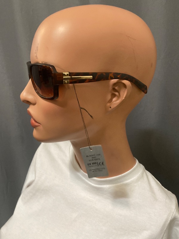 Photo 1 of  sunglasses feature a stylish tortoise frame with bifocal magnification lenses