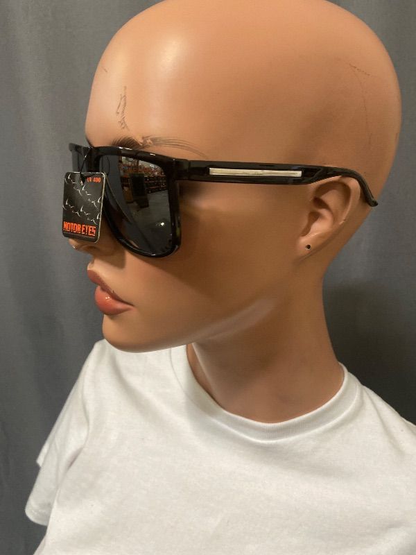 Photo 1 of sunglasses feature a black square frame with mirrored lenses and branded metal detailing on the temple
