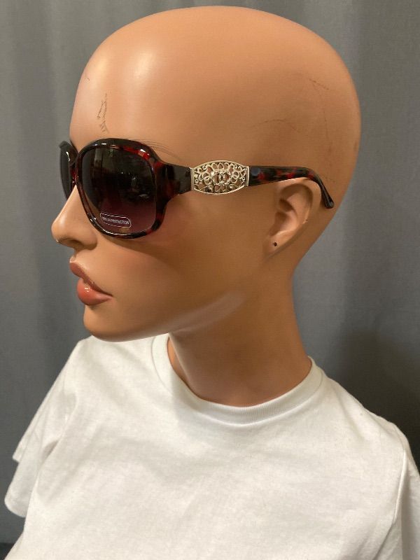 View 2 of brown tortoise shell Guess GF0411 sunglasses feature gold-toned filigree temples with an embedded rhinestones logo
