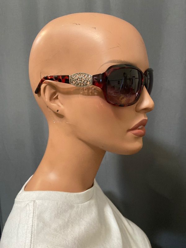 View 3 of brown tortoise shell Guess GF0411 sunglasses feature gold-toned filigree temples with an embedded rhinestones logo
