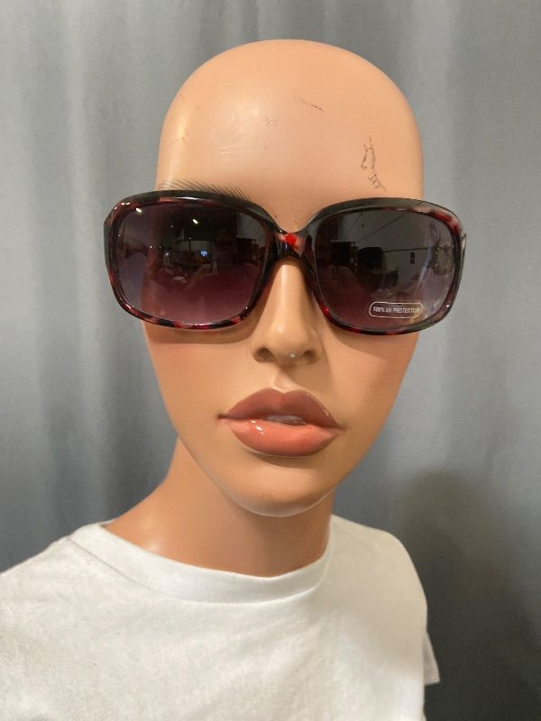 View 1 of brown tortoise shell Guess GF0411 sunglasses feature gold-toned filigree temples with an embedded rhinestones logo