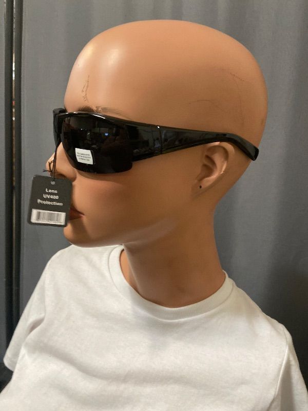 View 2 of black sunglasses feature a polarized shield design and a UV400 lens.