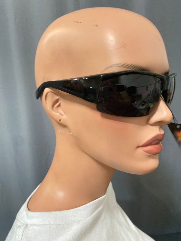 View 3 of black sunglasses feature a polarized shield design and a UV400 lens.