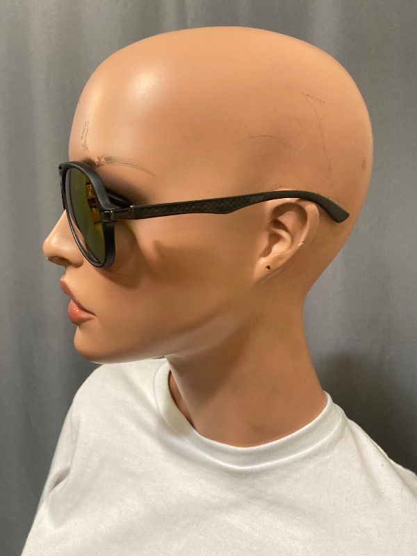 Photo 1 of black-framed aviator sunglasses feature distinctive red mirror lenses.
