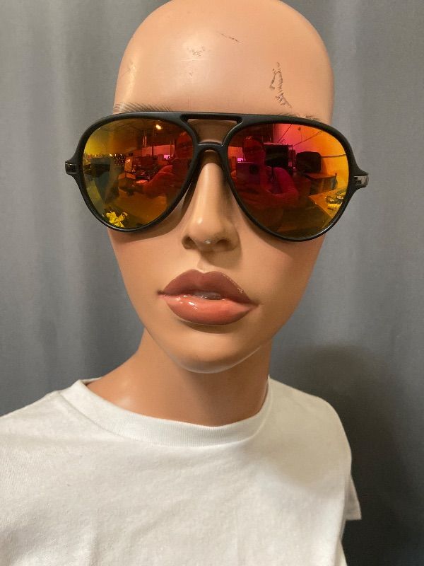 Photo 1 of black-framed aviator sunglasses feature distinctive red mirror lenses.