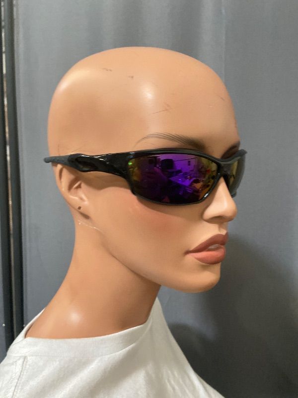 Photo 1 of polarized black sunglasses feature a wrap-around style with purple mirrored lenses.