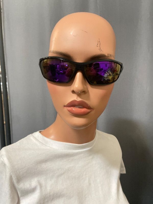 Photo 1 of polarized black sunglasses feature a wrap-around style with purple mirrored lenses.