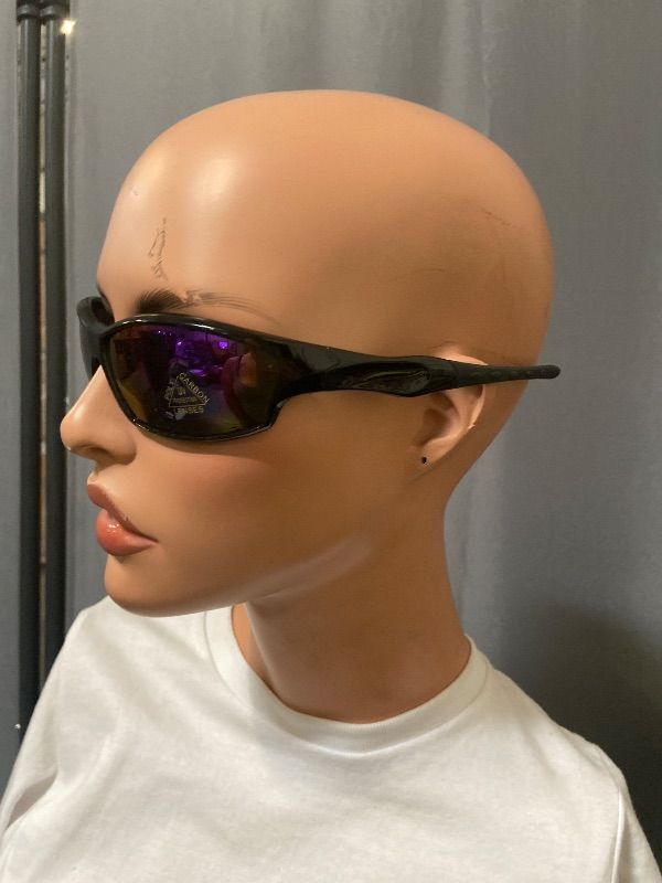 Photo 1 of polarized black sunglasses feature a wrap-around style with purple mirrored lenses.