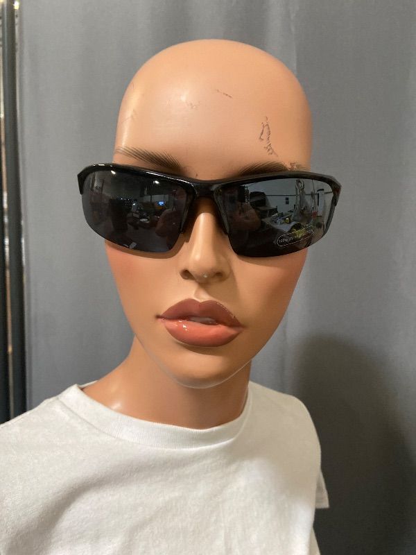 Photo 1 of X-Loop sunglasses feature a black half-frame design with a distinctive white logo on the temple.