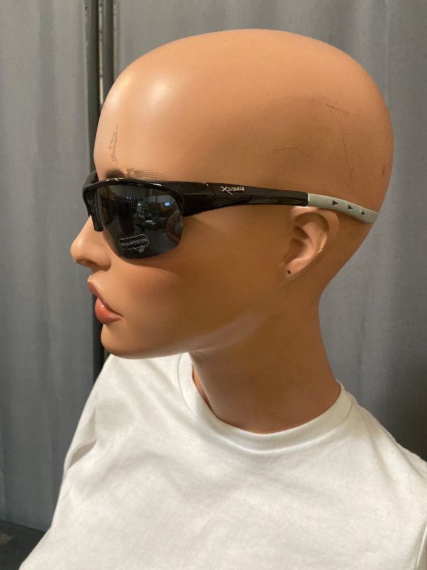 Photo 1 of X-Loop sunglasses feature a black half-frame design with a distinctive white logo on the temple.