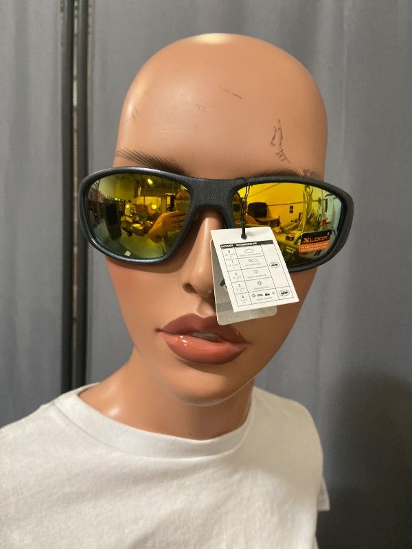 View 1 of X-Loop sports sunglasses feature a durable black frame and vibrant yellow mirrored lenses.