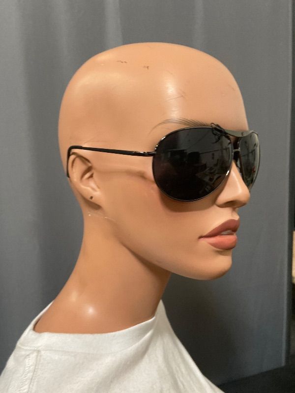 View 3 of aviator sunglasses featuring a dark ruthenium frame and black lenses.