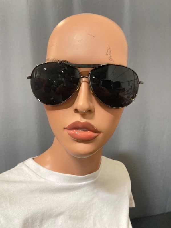 View 1 of aviator sunglasses featuring a dark ruthenium frame and black lenses.