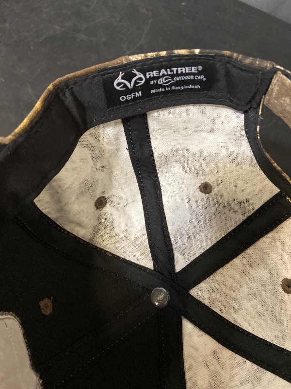 Photo 1 of  Realtree structured baseball hat features a distinctive camouflage pattern and a centered embroidered logo patch