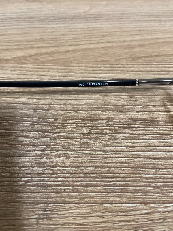 Photo 1 of brown metal eyeglasses are a classic rectangular style designed with comfortable spring hinges, "PL0413 DEAN GUN" inscribed on the temple +2.00 lens power.