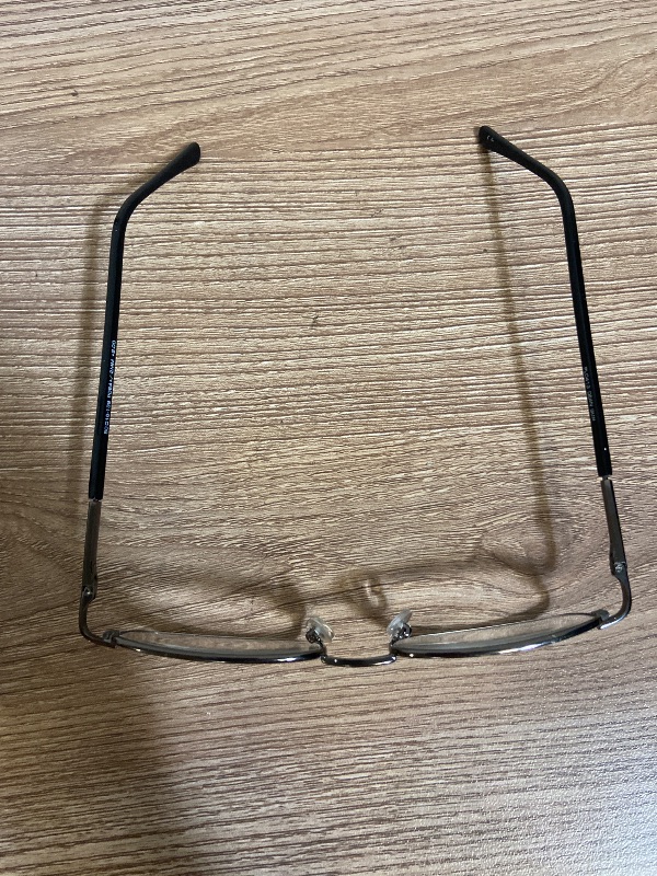 Photo 1 of brown metal eyeglasses are a classic rectangular style designed with comfortable spring hinges, "PL0413 DEAN GUN" inscribed on the temple +2.00 lens power.