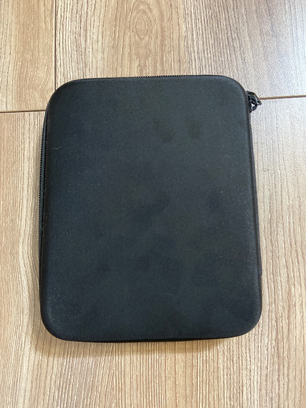 Photo 1 of black, hard-shell carrying case branded with the "ESCORT" logo, designed specifically for radar detectors