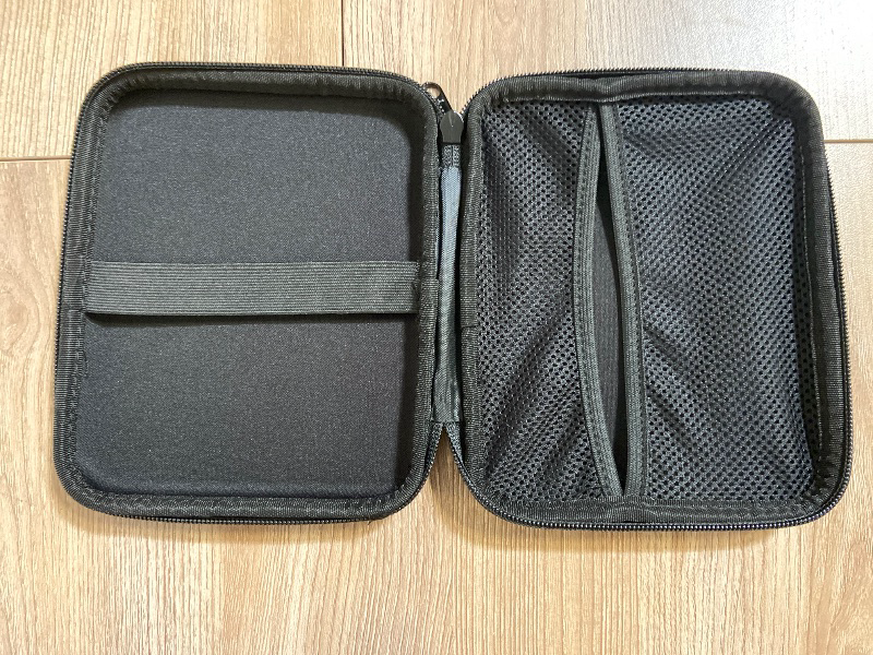 Photo 1 of black, hard-shell carrying case branded with the "ESCORT" logo, designed specifically for radar detectors