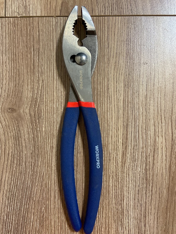 Photo 1 of 10-inch WORKPRO Slip Joint Plier. It features two adjustable jaw positions, an integrated wire-cutting shear, and dual-material dipped comfort grips designed for gripping, bending, and turning applications