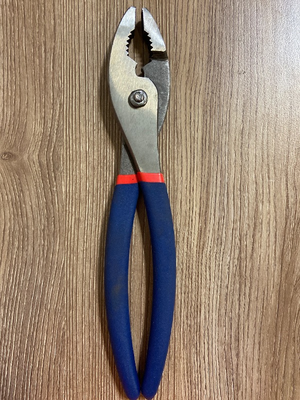Photo 1 of 10-inch WORKPRO Slip Joint Plier. It features two adjustable jaw positions, an integrated wire-cutting shear, and dual-material dipped comfort grips designed for gripping, bending, and turning applications
